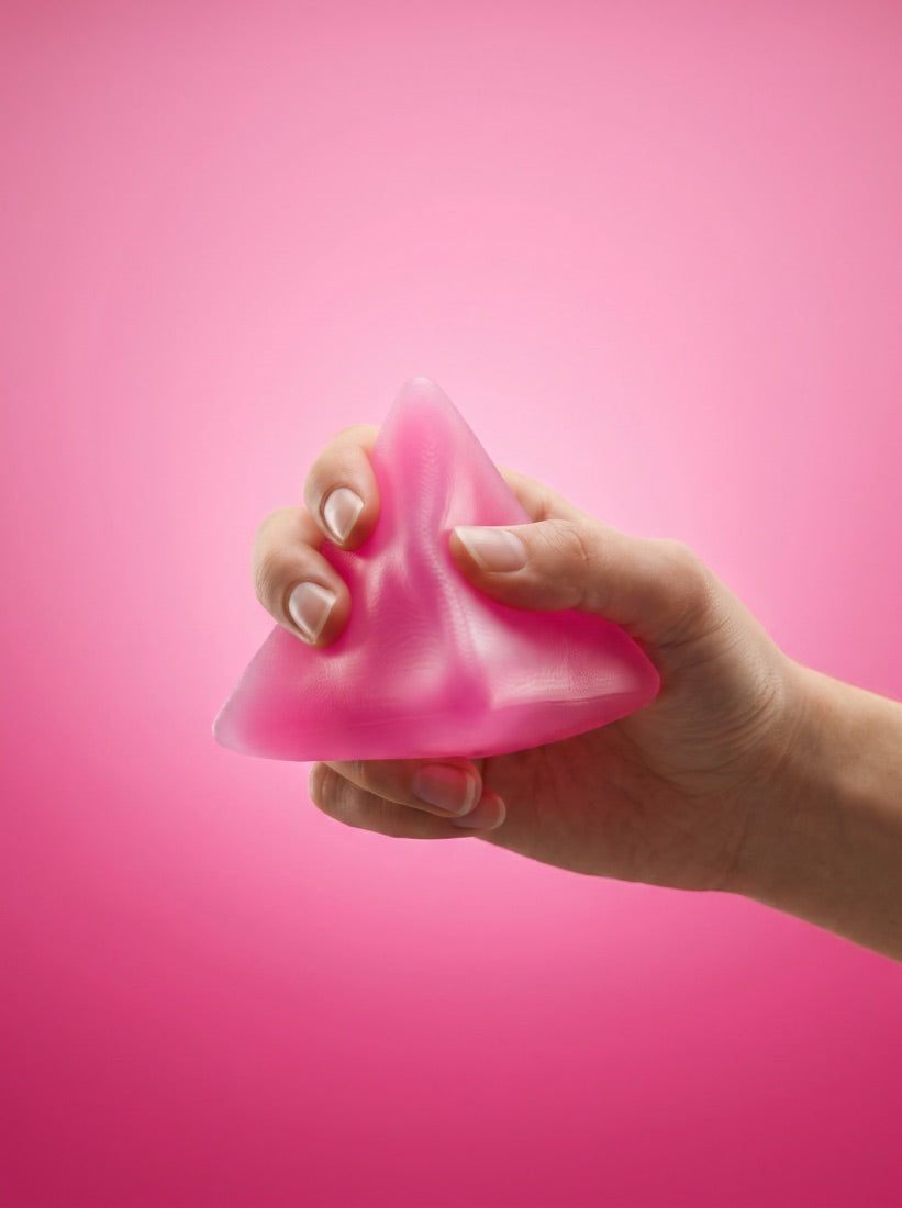 The Pyramid squeezed in one hand