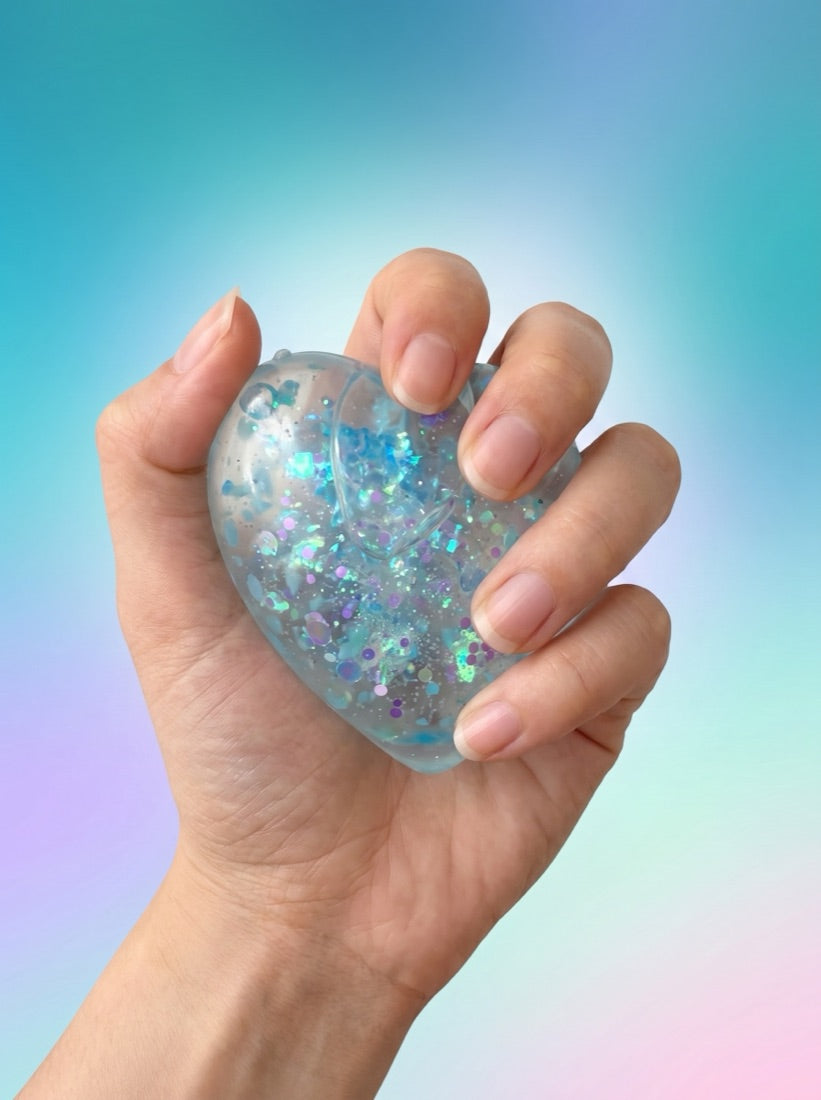The Heart held in one hand