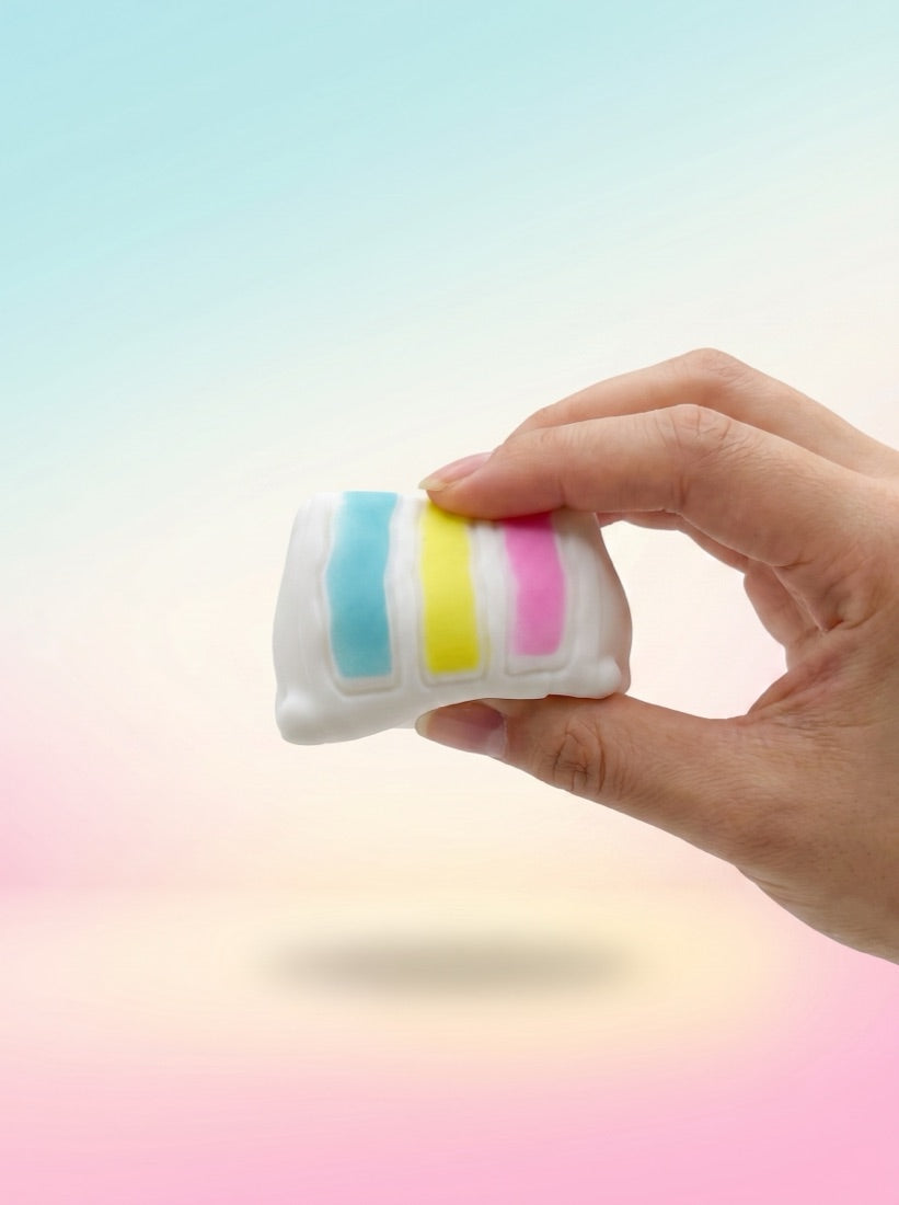 The Cake Slice held between two fingers